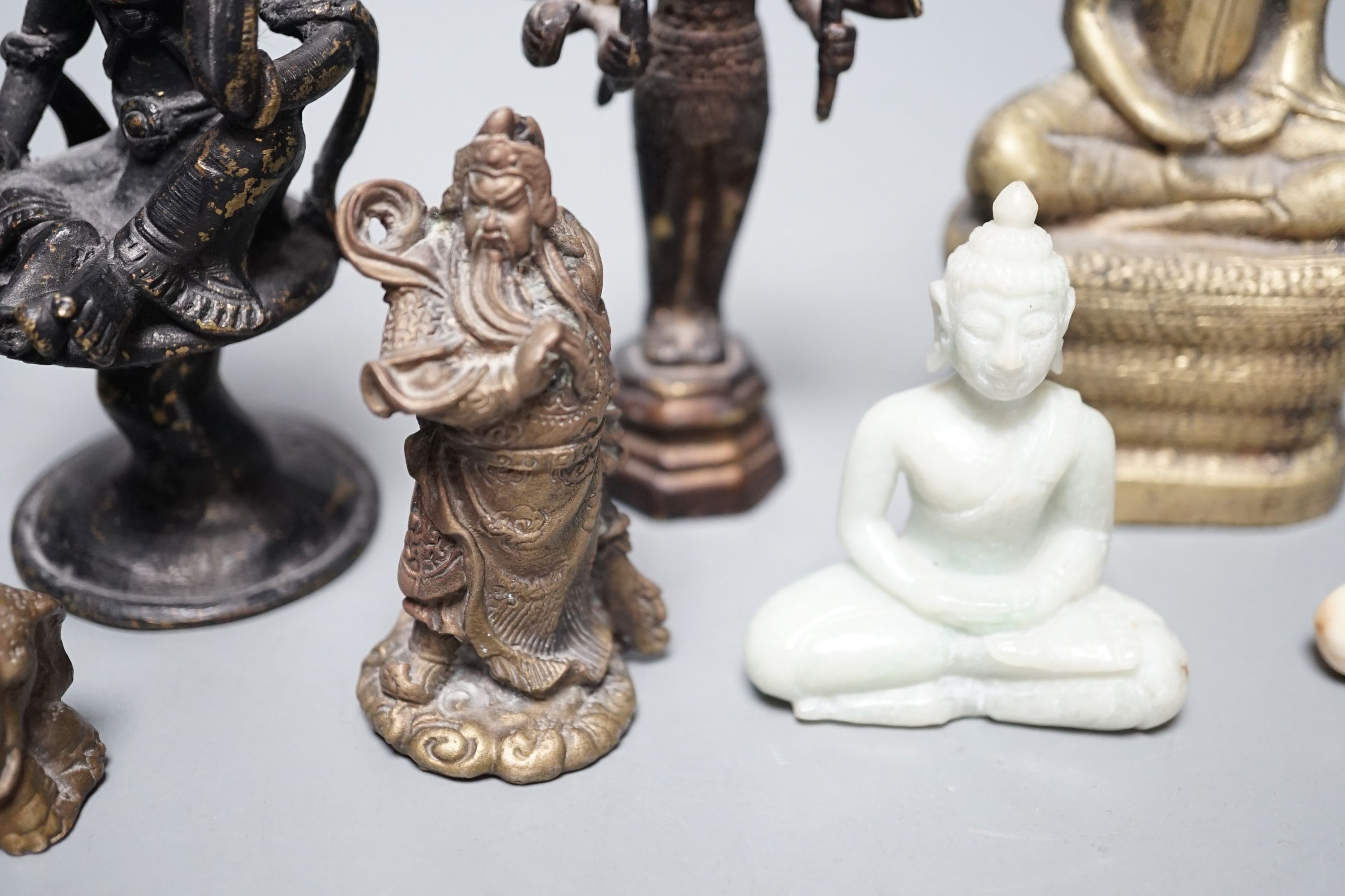 A quantity of Indian and South East Asian bronze and brass models of deities etc.